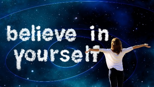 Woman looking at a cosmic sky with clouds forming believe in yourself message, symbolizing self-confidence